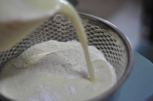 roti jala recipe pour wet ingreients into flour 300x199 Roti Jala   Easy Malaysian Lacy Pancakes